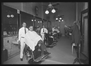 Unidentified itinerant photographer, "Barber Shop in the Nueces Hotel," 1934.Gelatin silver glass plate negative.
