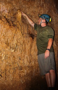 Jud Partin inspects a stalagmite in Taurius Cave on the island of Espiritu Santo, Vanuatu