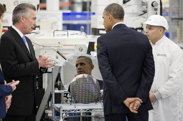 During a trip to Austin in May 2013, President Obama visited Applied Materials. Here, he stands in front of a 450-mm wafer designed by Molecular Imprints, a company founded by Cockrell School professors S.V. Sreenivasan and Grant Willson. (Photo provided by Molecular Imprints.)