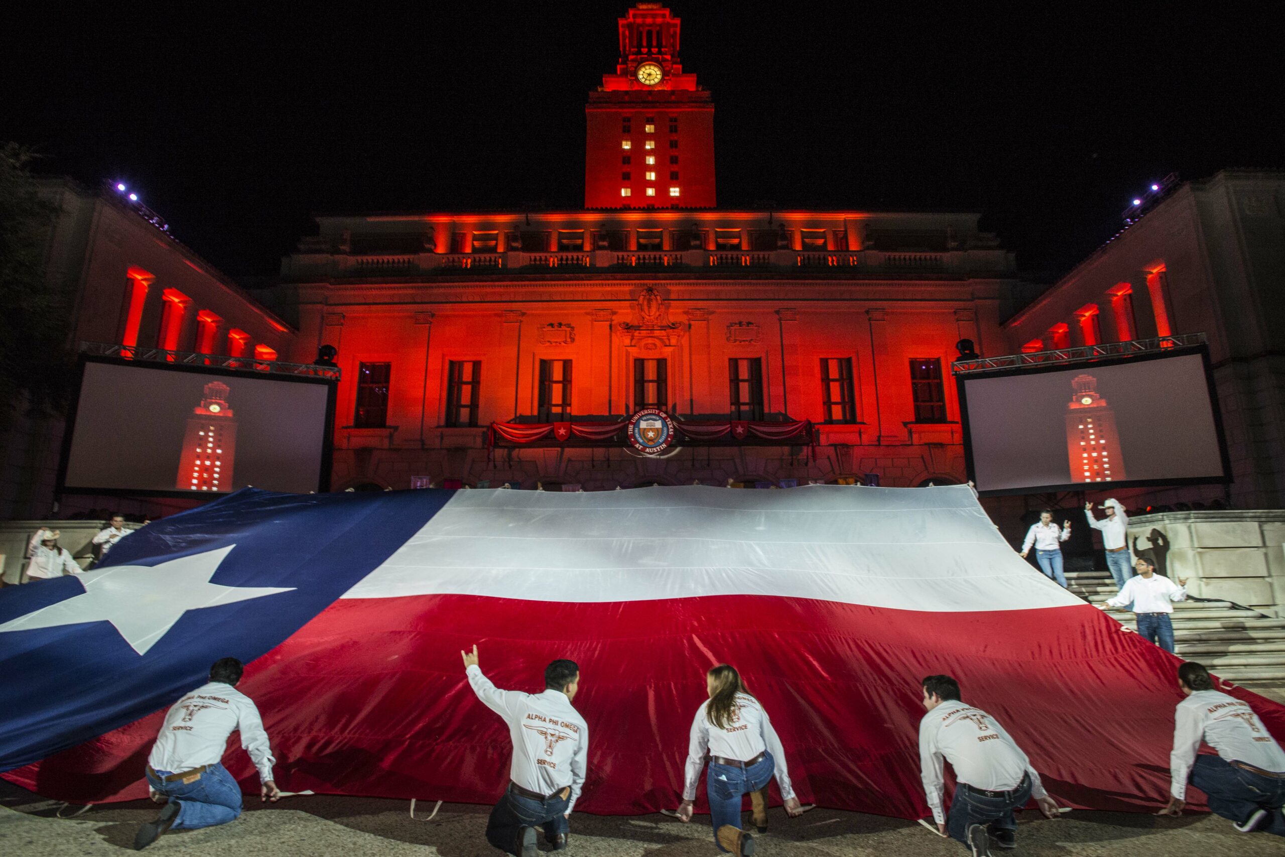 Students display the state flag during Gone to Texas.