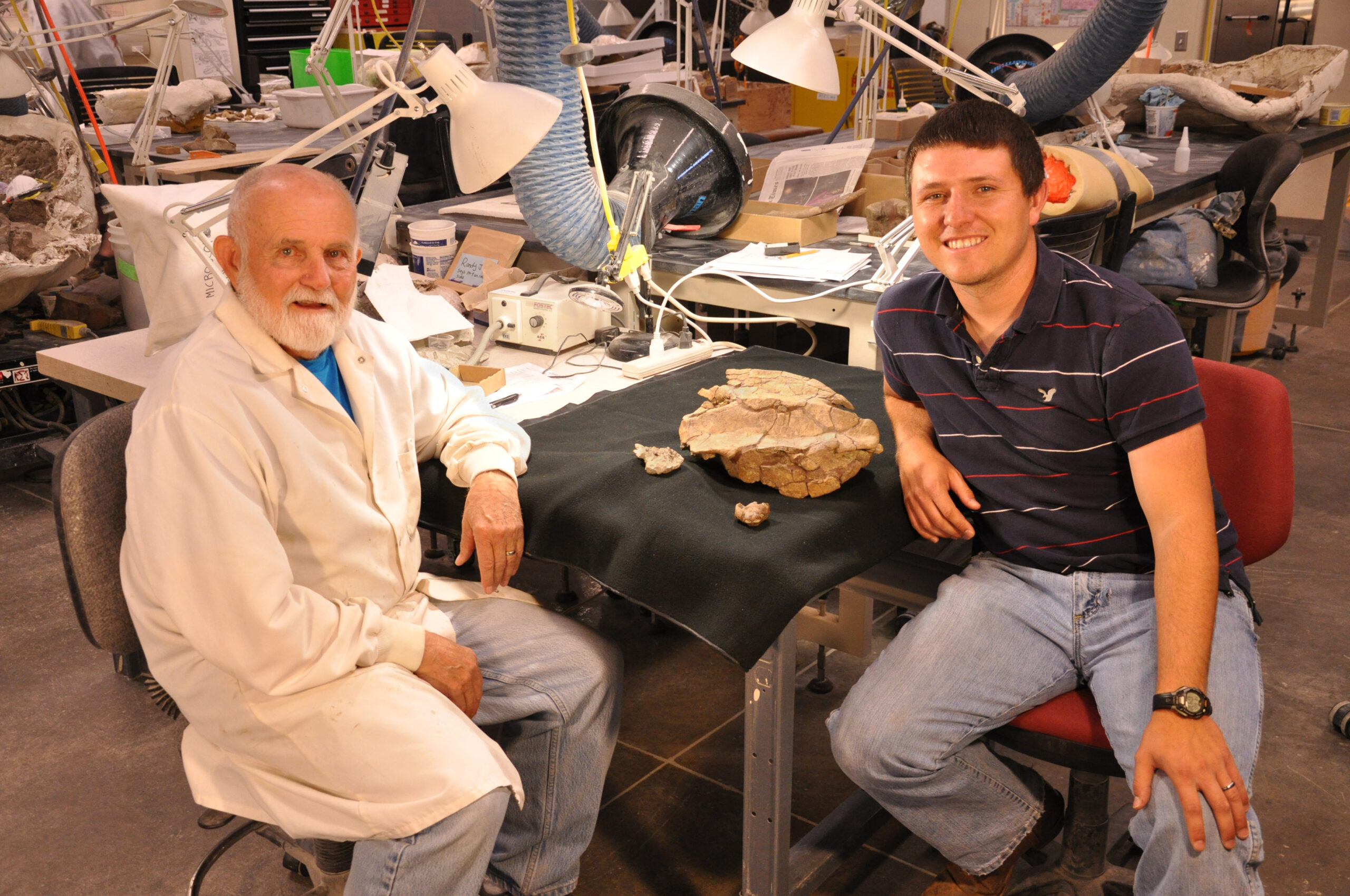 Researchers with pig-nose turtle fossil