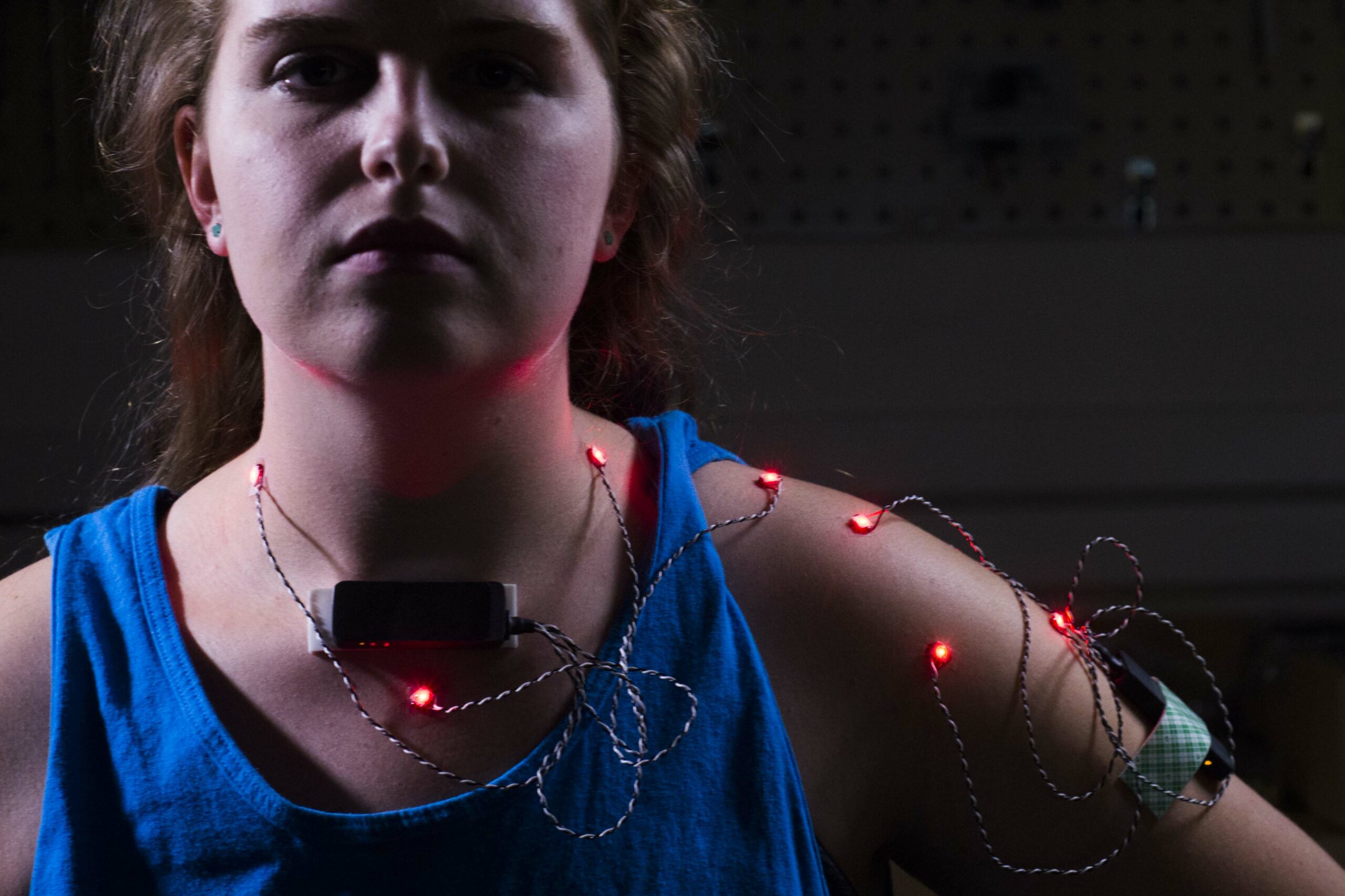 Engineering student Emma Nevendorff models sensors used to track shoulder motion