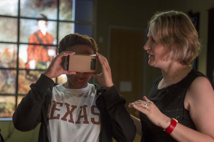 Janine Barchas in the Vislab with Student using google cardboard. 