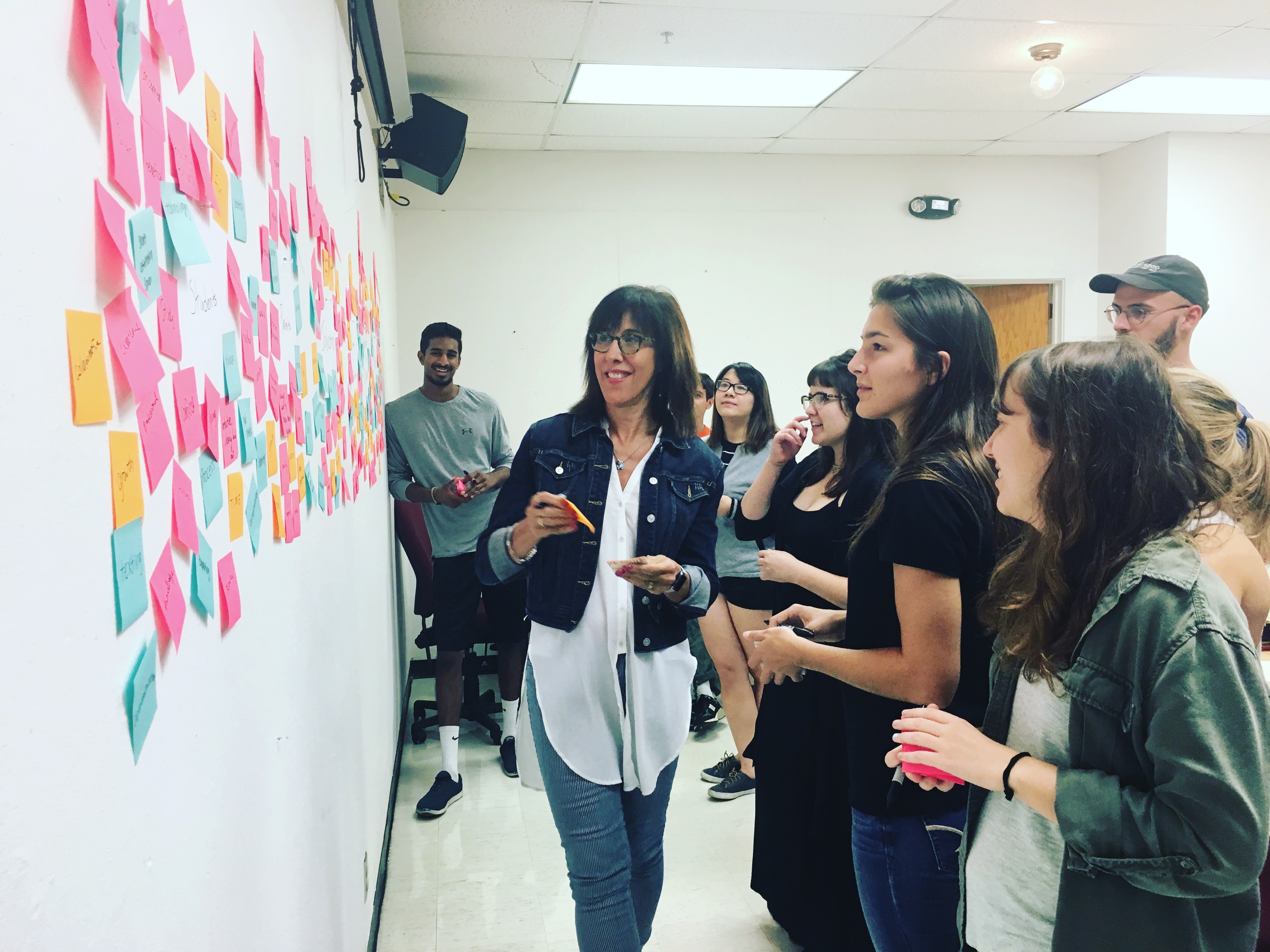 Doreen Lorenzo works with UT students on branding materials for the Center for Integrated Design.