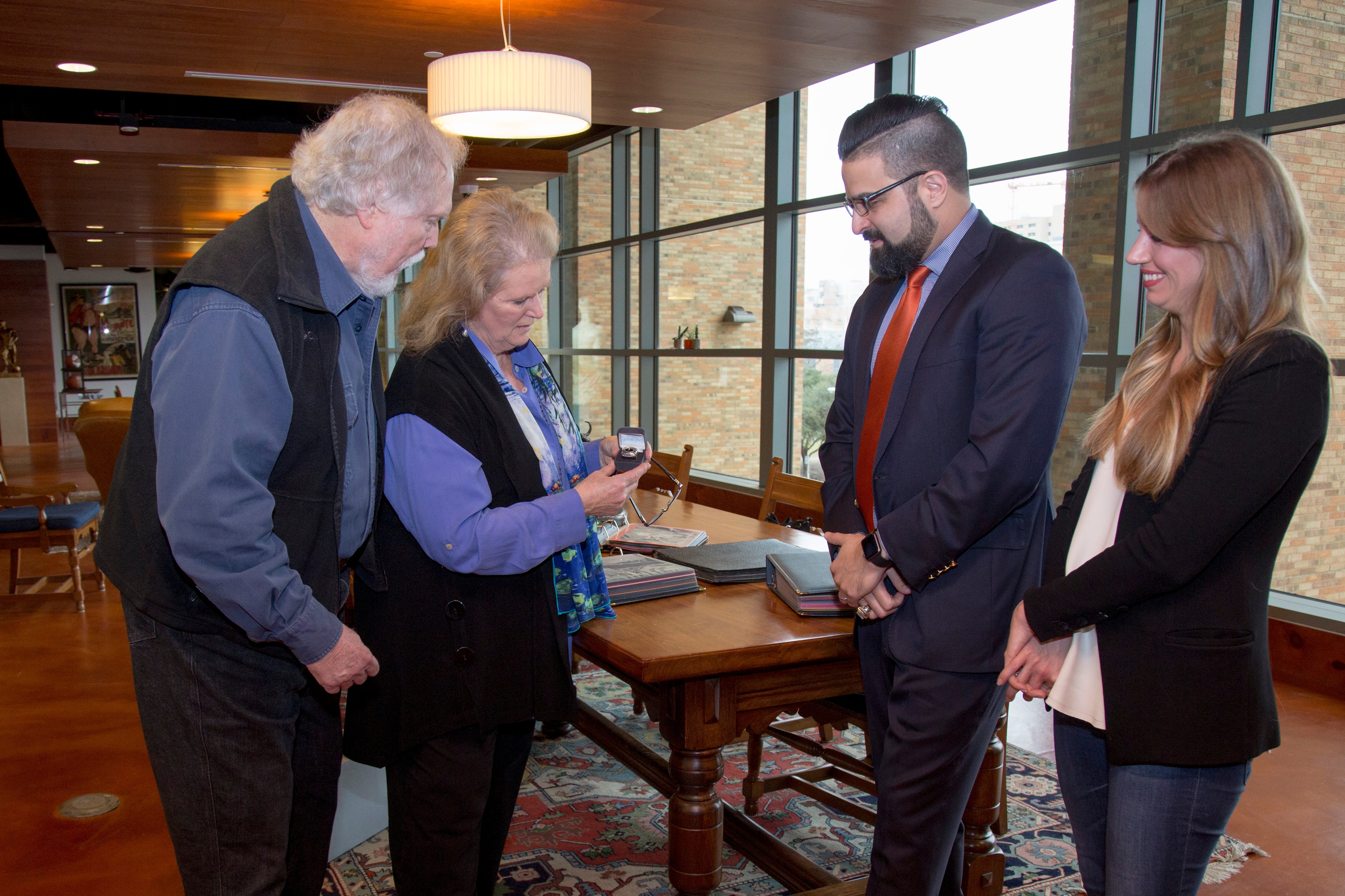 photo of the Todds and Abbouds with championship ring