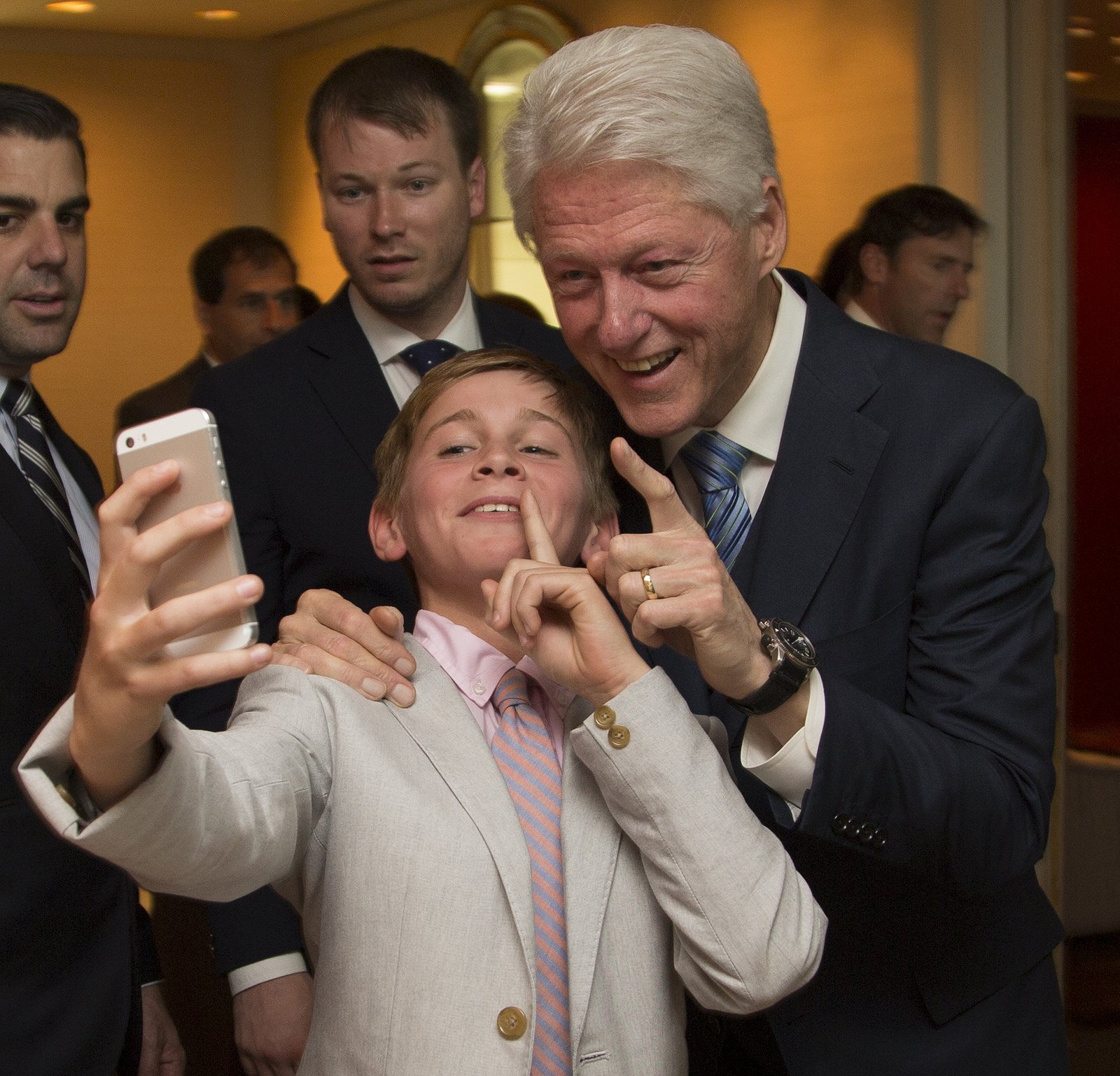 Bill Clinton poses for a selfie