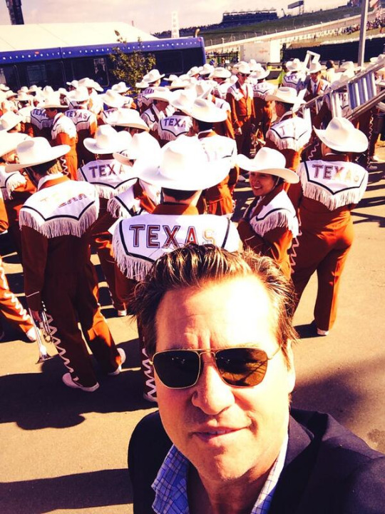 Val Kilmer takes a selfie with the Longhorn Band in 2013