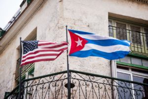 American and Cuban flags side by side