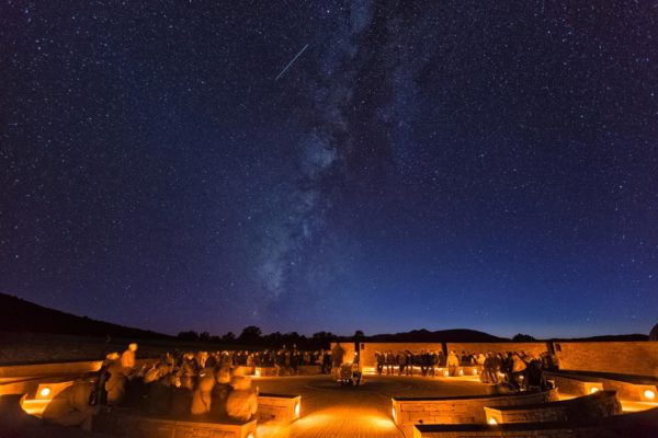 McDonald observatory's sky lit up with stars at night.