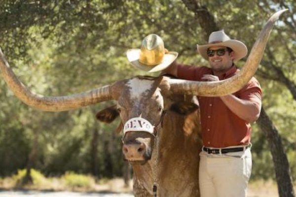 Bevo XIV with Texas cowboy Zach Mafrig.