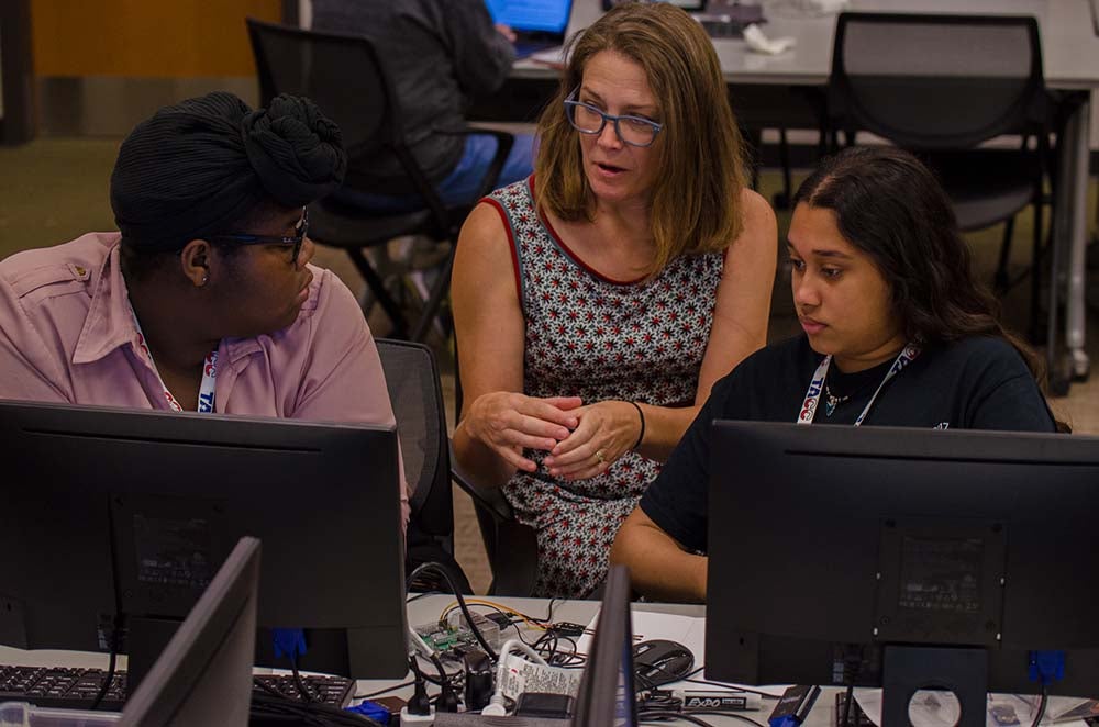 Suzanne Pierce, a research scientist at TACC and organizing committee member of Planet Texas 2050 mentors students about environmental sensors and citizen science.