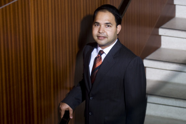 Energy Institute Executive Director Varun Rai pictured on staircase.