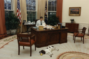 George H.W. Bush working at Oval Office Desk