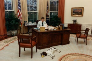 George H.W. Bush working at Oval Office Desk