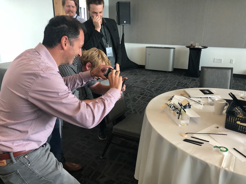 Salvatore Salamone laughs and snaps a photo of an impromptu design.