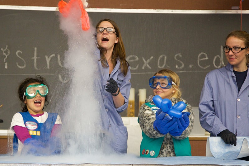 science experiment on stage at girl day event on ut austin campus