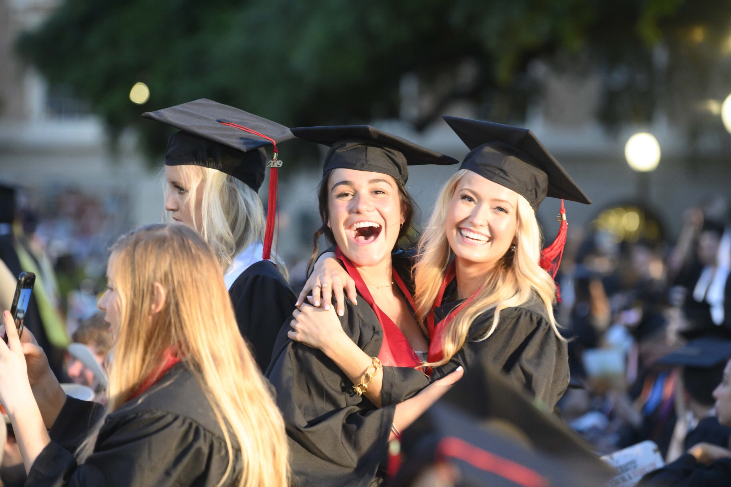 Commencement 2019 Saturday evening. Two girls posing for a photo.