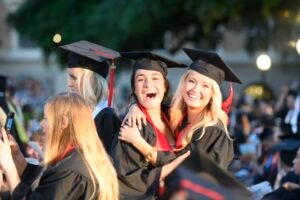 Commencement 2019 Saturday evening. Two girls posing for a photo.