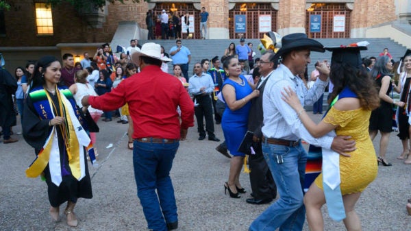 Families dancing at the LatinX graduation.