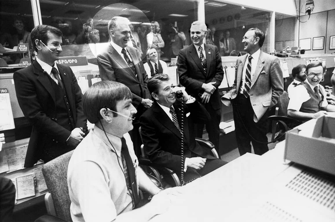 Hans Mark in mission control with President Reagan. Hans Mark in mission control with President Reagan.