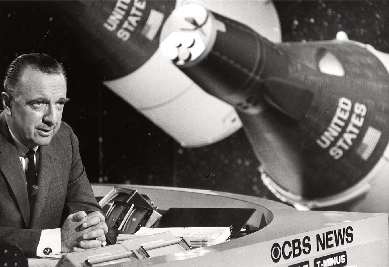 Walter Cronkite at desk and reporting. Walter Cronkite at desk and reporting.