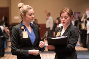 UT student workers and nursing students at a job fair.