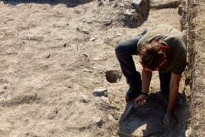 Student digs in a trench