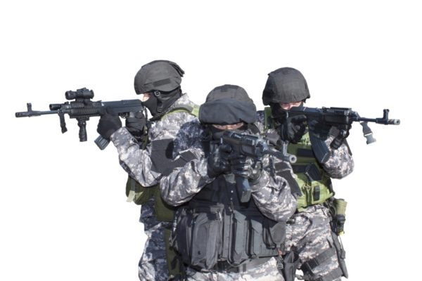 Three military members holding guns