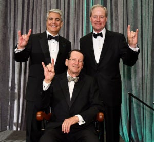 Fenves, Cockrell, Dittrich holding hook em horns