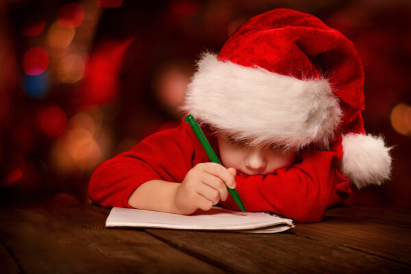 Christmas child writing letter to Santa