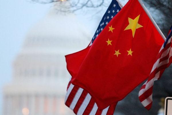 The People’s Republic of China flag and the U.S. Stars and Stripes fly along Pennsylvania Avenue near the U.S. Capitol in Washington