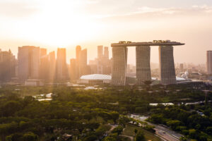 a view of the cityscape of singapore at sunset