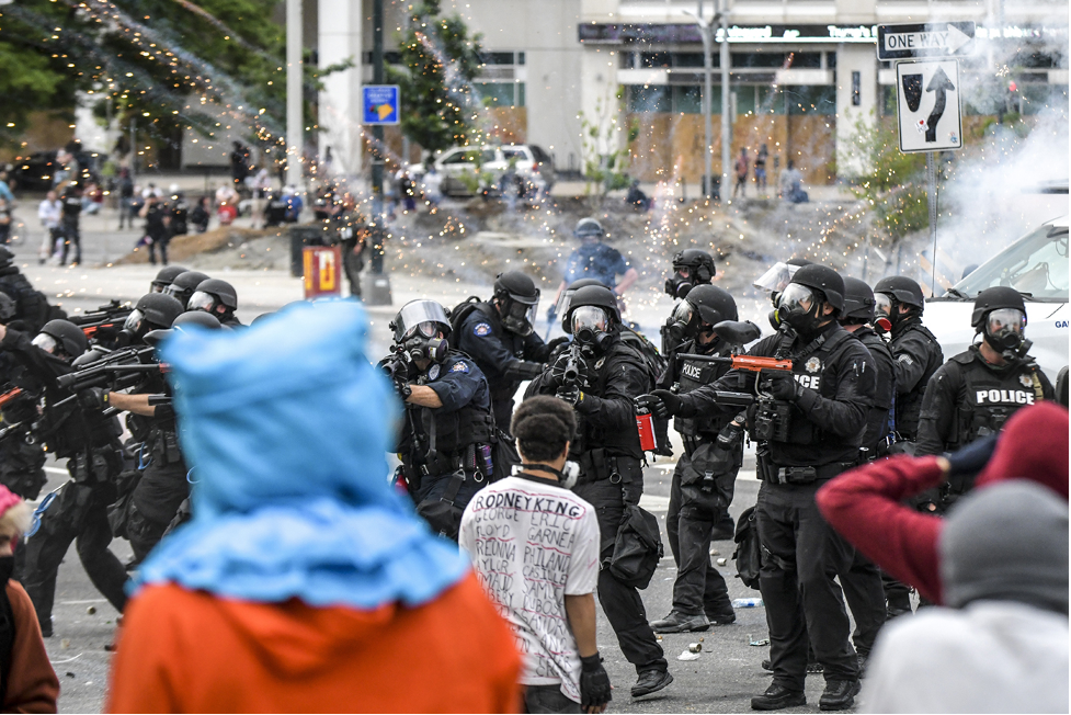 People and Police officers at a protest