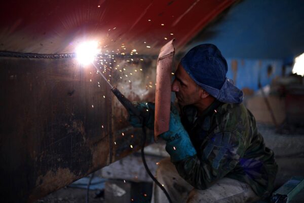 Young male welding
