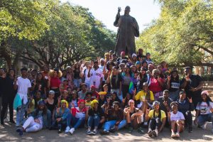 Jalesha Bass with fellow students at the MLK Jr. statue on UT's East Mall.