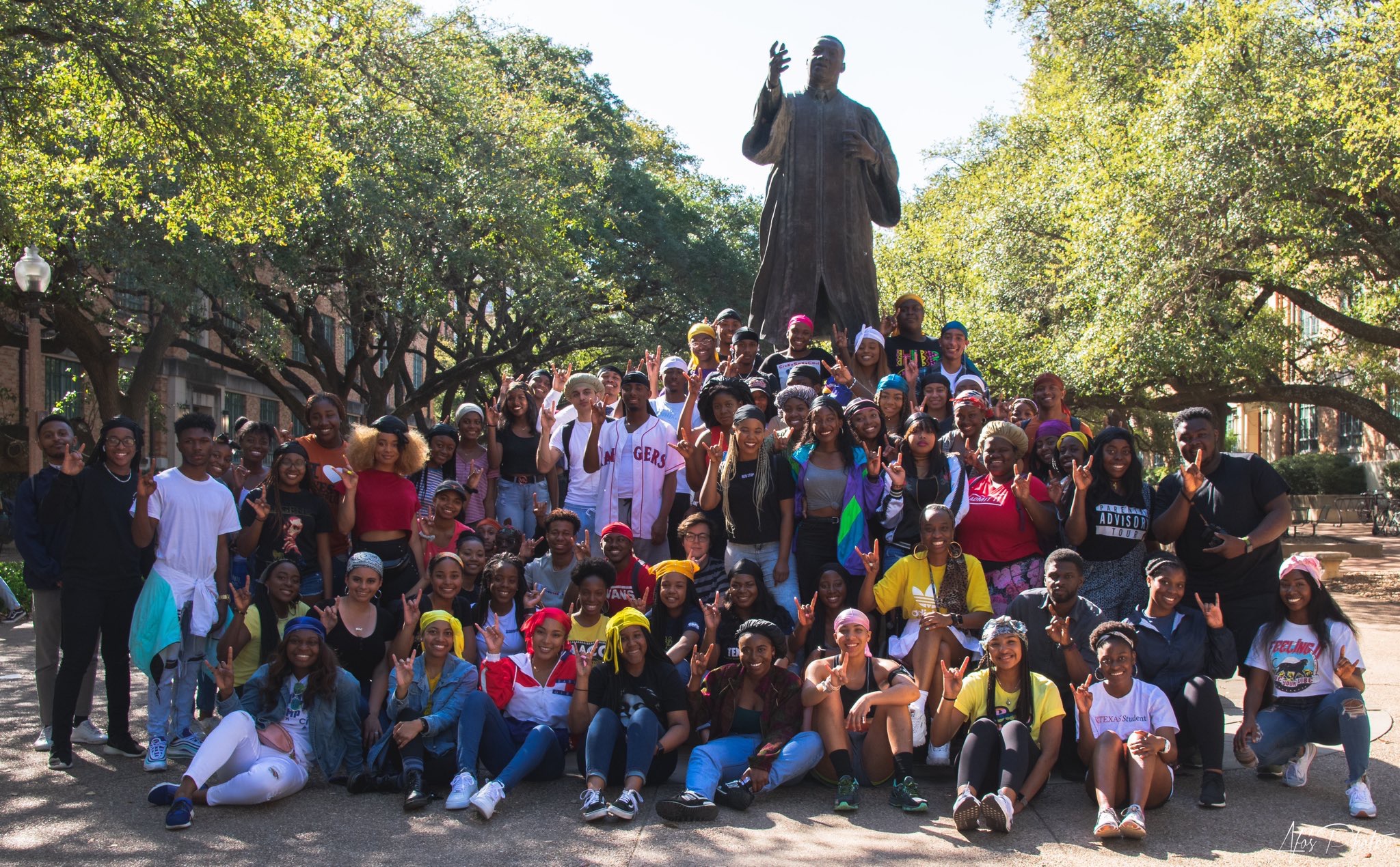 Jalesha Bass with fellow students at the MLK Jr. statue on UT's East Mall.