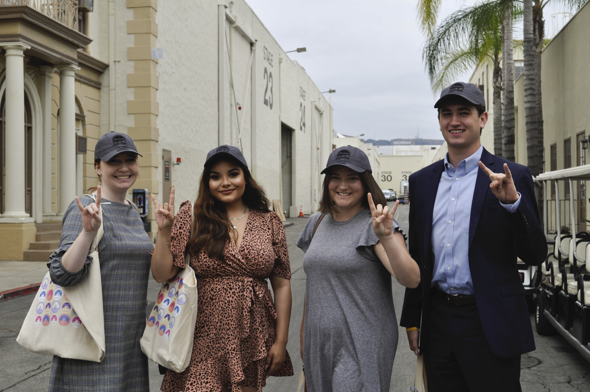 UT students doing the "hook 'em" sign outside of Paramount Pictures Studios