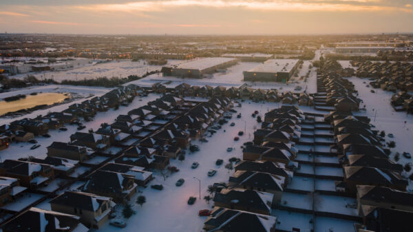 golden hour Sunrise over Texas Landscape covered in White Powder Snow during winter storm Uri