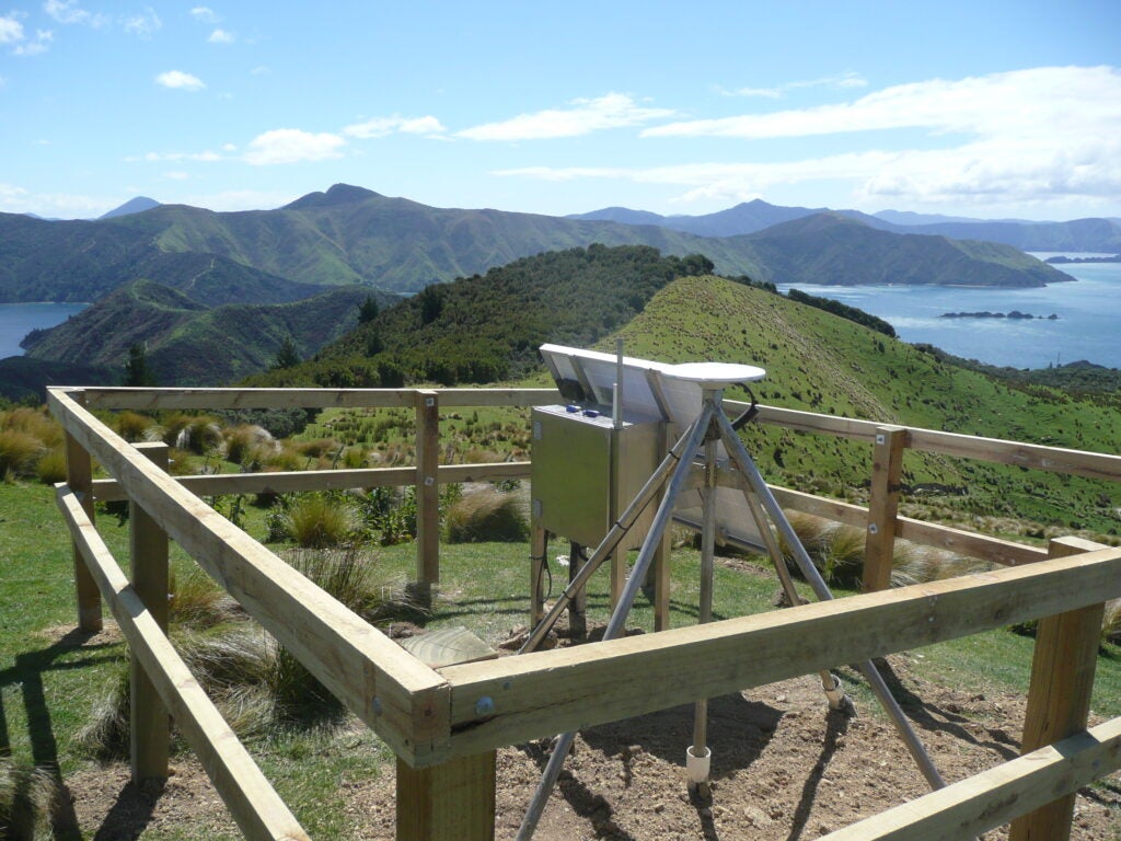 Sensor station overlooking mountains and water.