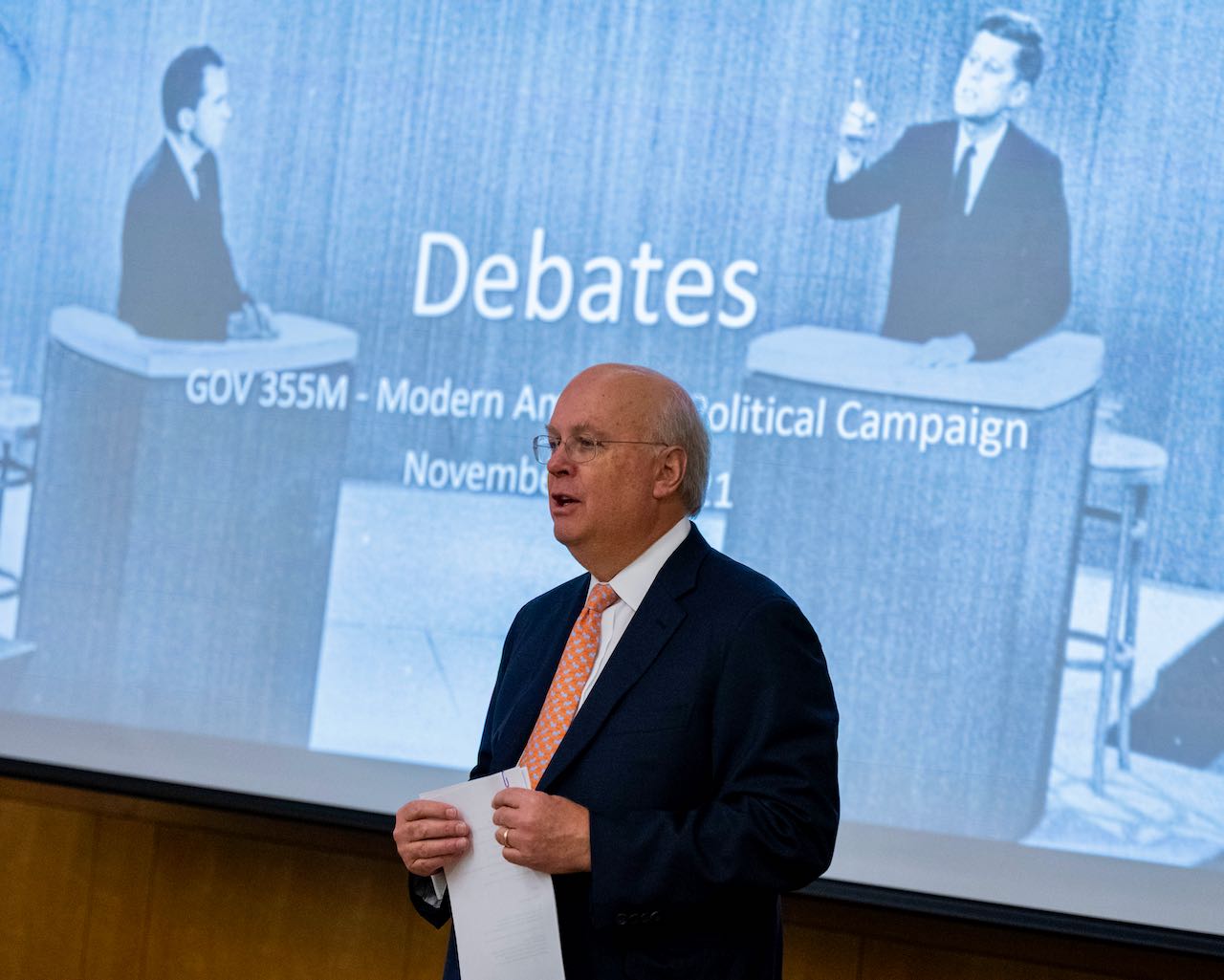 Karl Rove in front of slide of Kennedy-Nixon debate.