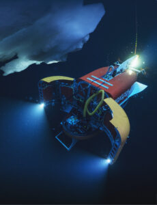 The robot in action underwater. The lights from its open payload bay doors light up ice underwater