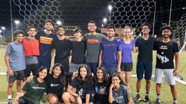 UT students on soccer field.
