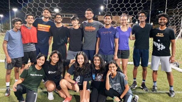 UT students on soccer field.