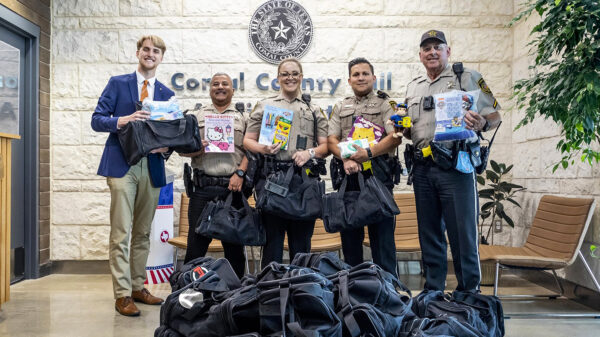 Beaton passing out bags at Comal County Sheriff's Office