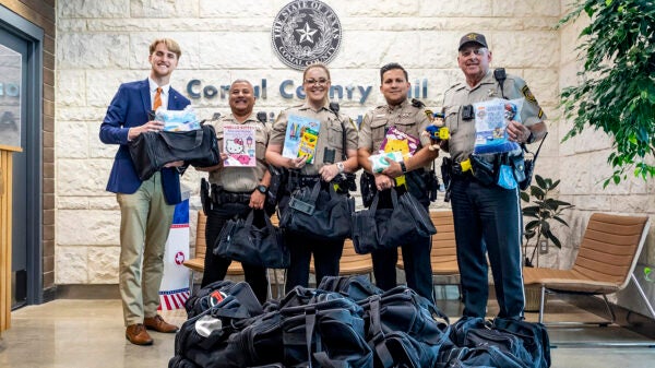 Beaton passing out bags at Comal County Sheriff's Office