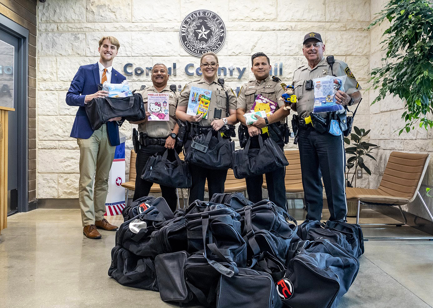 Beaton passing out bags at Comal County Sheriff's Office