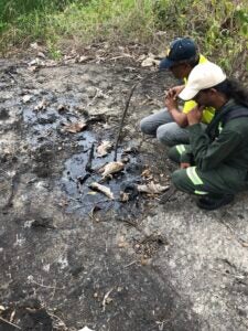 Ryan Mohammed inspecting a tar pit