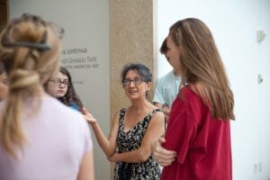 Yolanda Padilla speaks with students inside a building