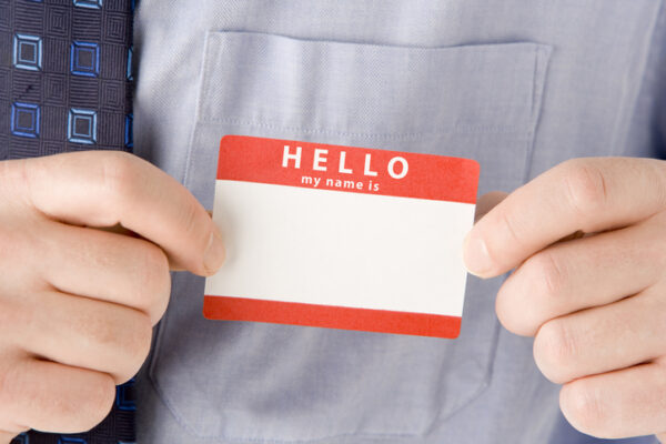 Close Up Of Businessman Attaching Name Tag