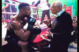 08_web_Behind-the-scenes photograph of Michael B. Jordan and Irwin Winkler on the set of Creed II, 2018. Irwin Winkler Papers, Harry Ransom Center